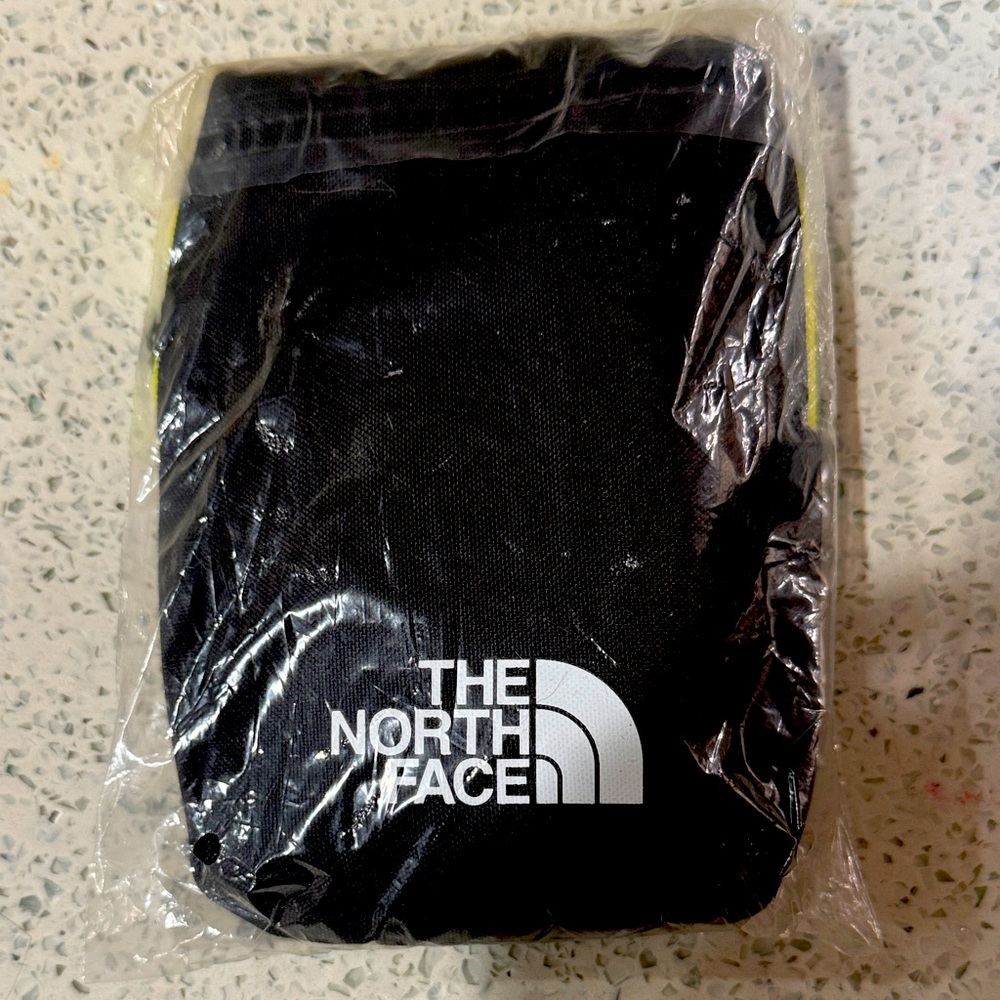 The North Face Black Pouch with White Logo and Yellow Trim China airline